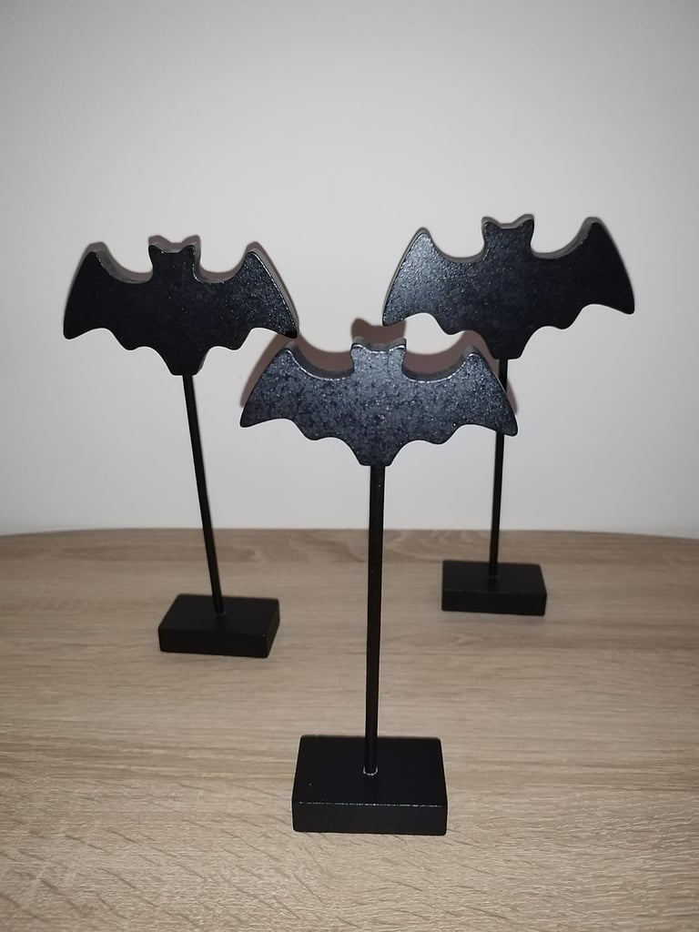 Three black wooden bat figurines on stakes with bases, Gothic Halloween tabletop decoration 
