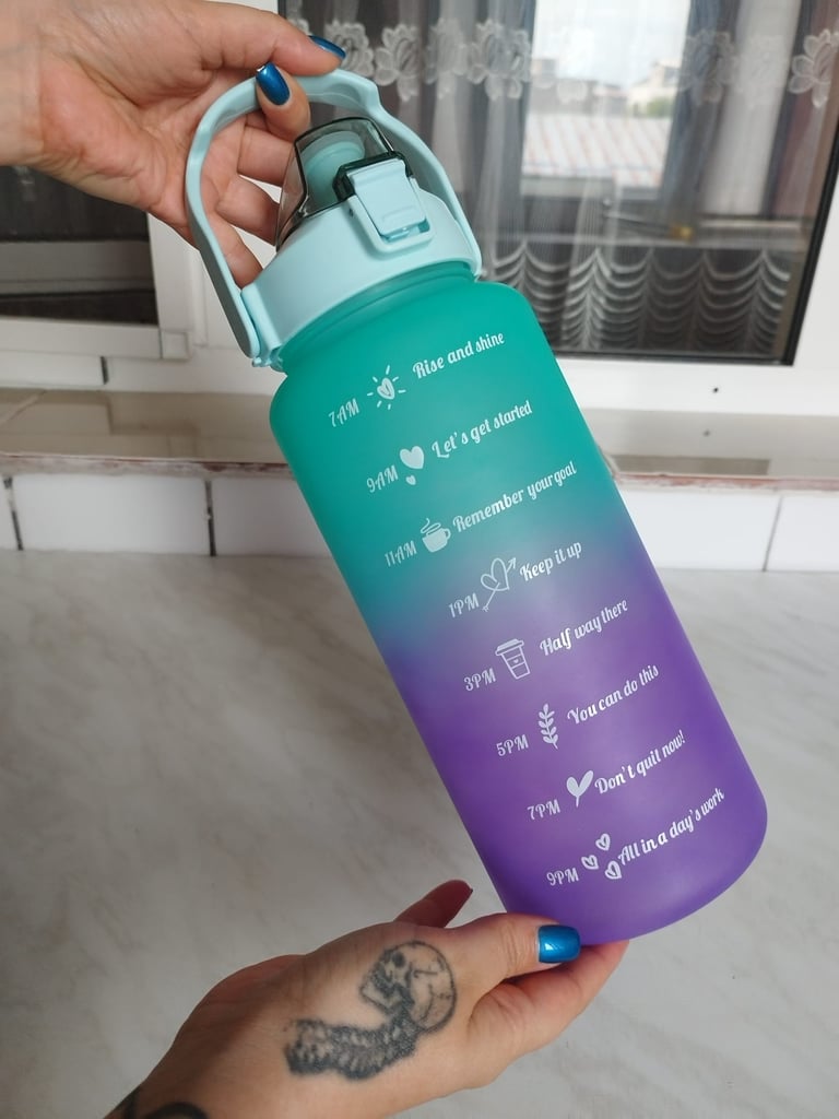 Green gradient 64 oz motivational water bottle with time markers, straw, leakproof flip-top lid