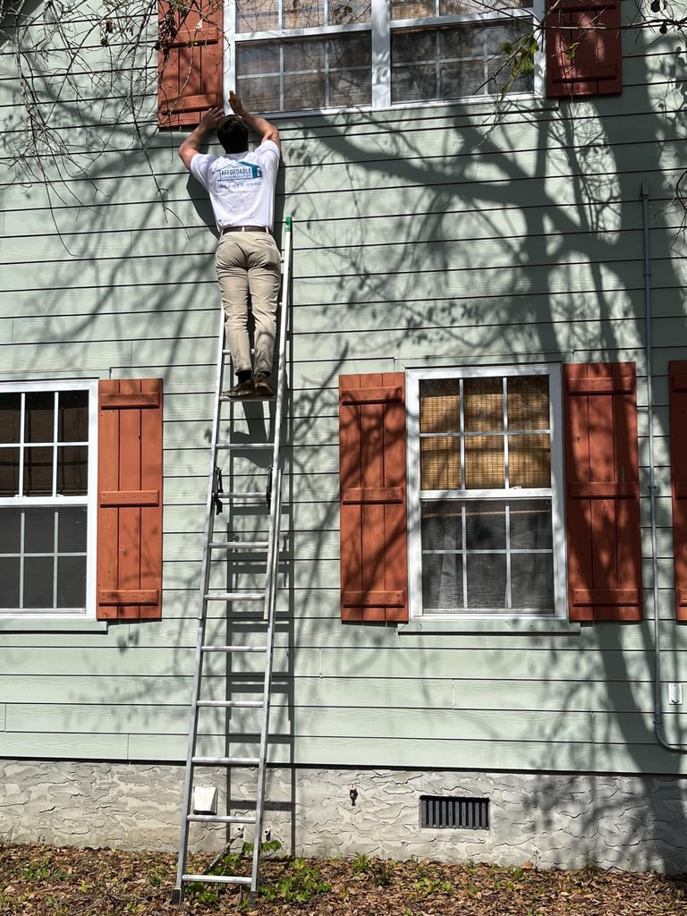Custom window screen installation for a residential home in Myrtle Beach.