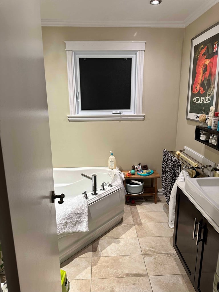 a bathroom with a tub in the corner