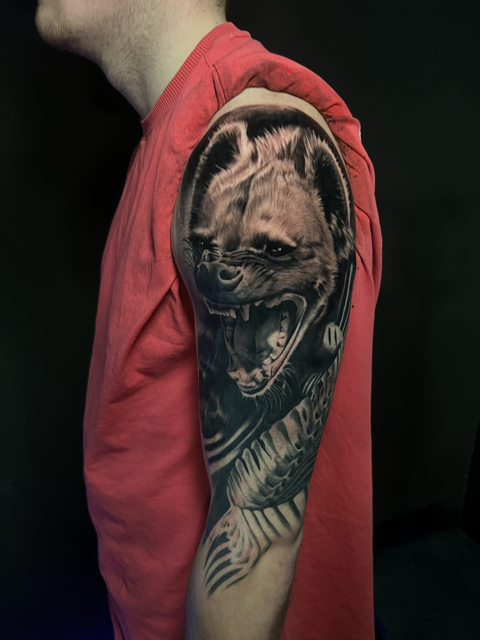 a man with a tattoo on his arm 