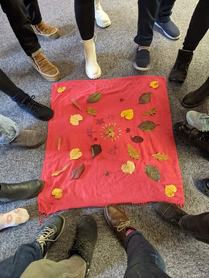 feet around mandala of leaves