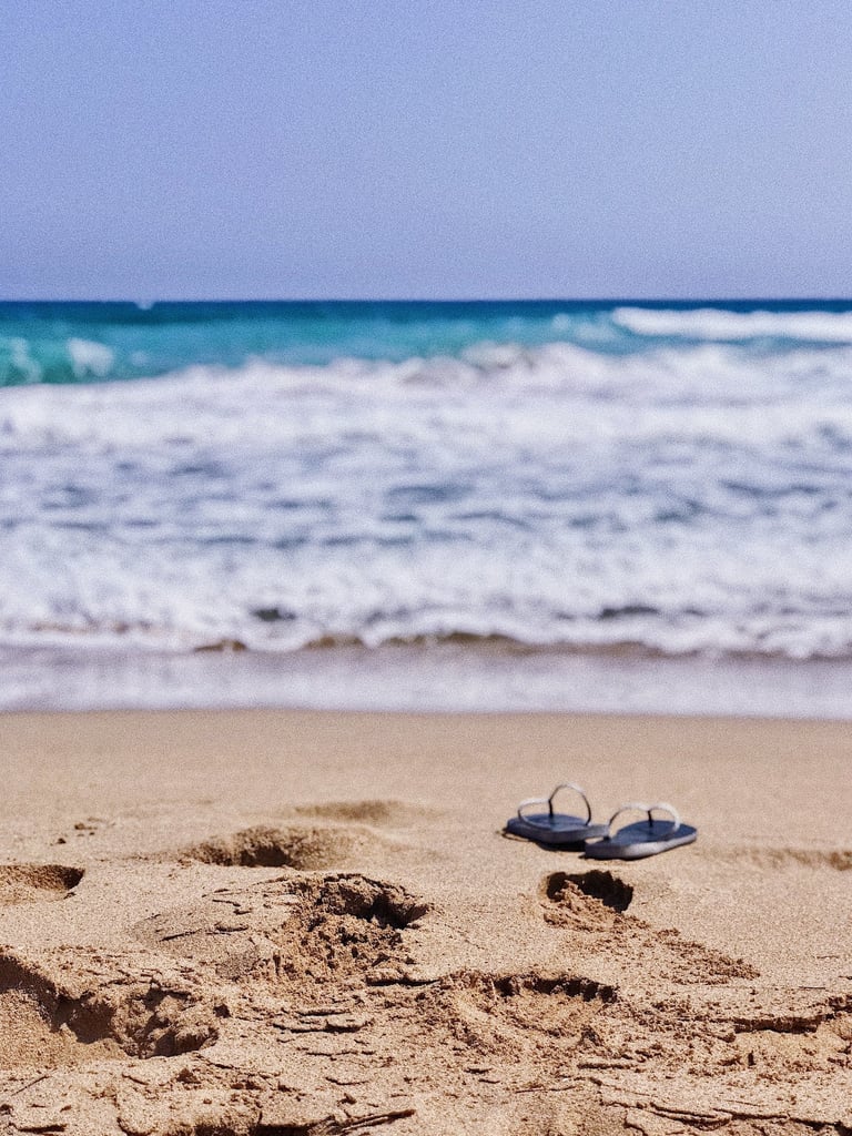 a pair of flip flop on the beach