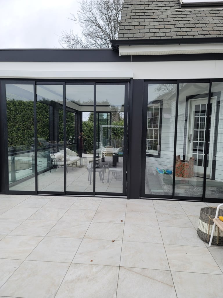 Sliding glass door system for outdoor patio enclosure