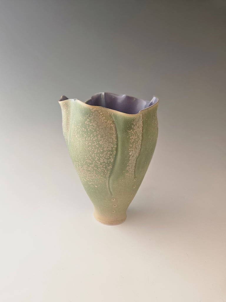porcelain tulip vessel, pale green & lavendar microcrystalline glaze. Handbuilt. Highfired ^10