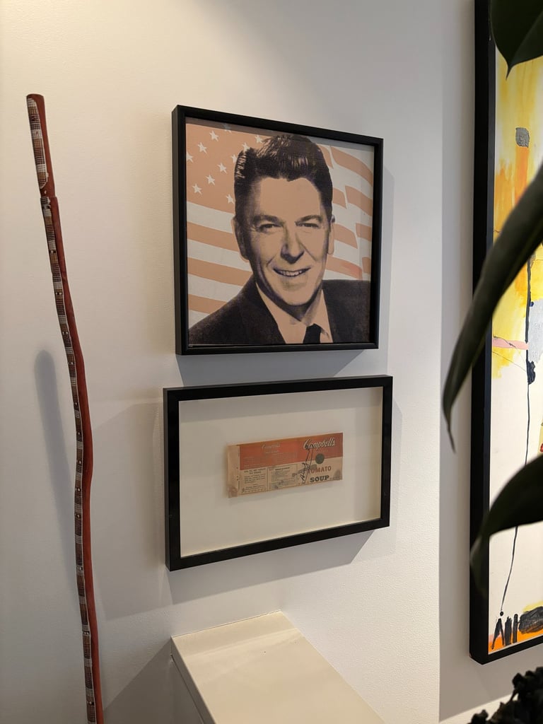 A couple of Andy Warhols double hung above a stairwell
