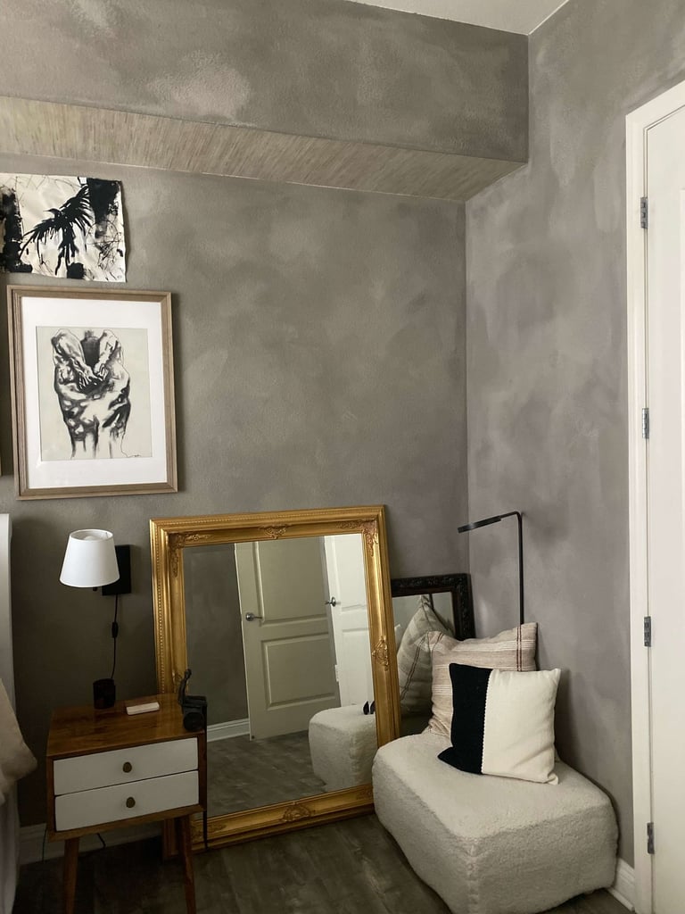 a couch with pillows and pillows in a room