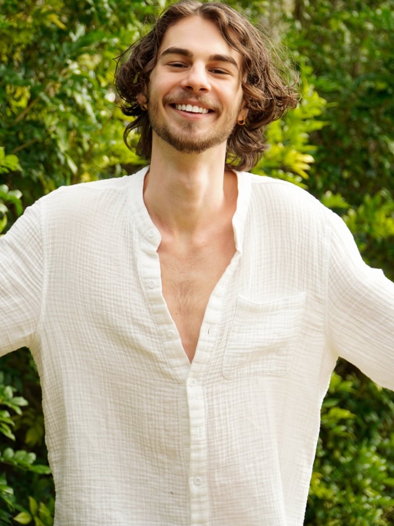 a man with a beard and a white shirt