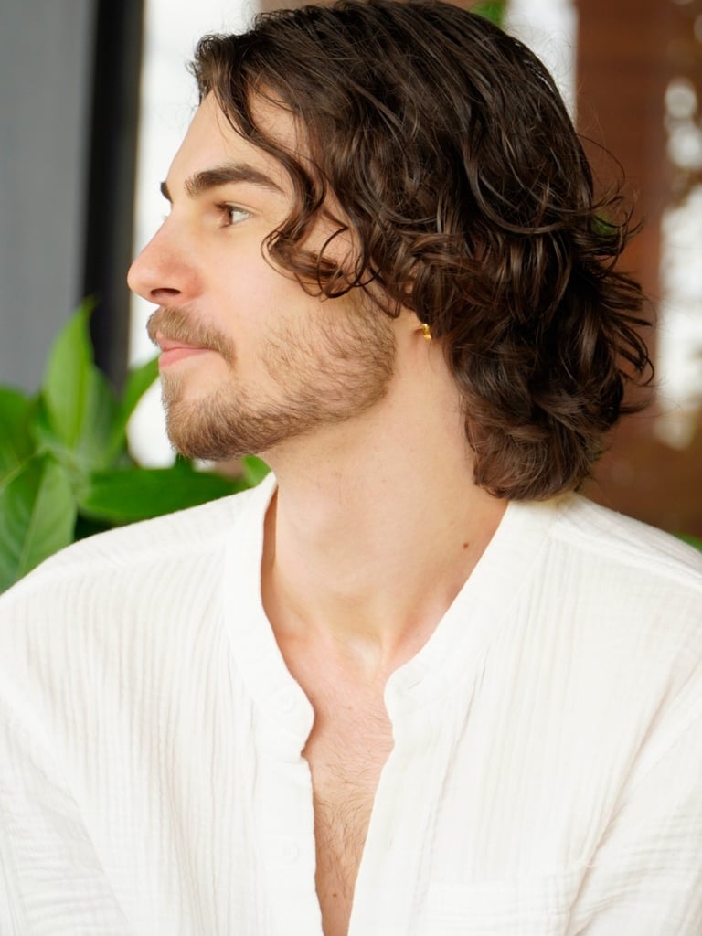 a man with a beard and a white shirt