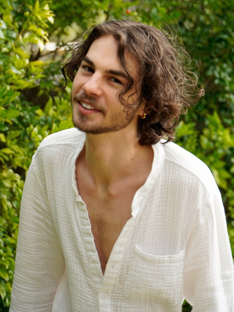 a man with a beard and a white shirt