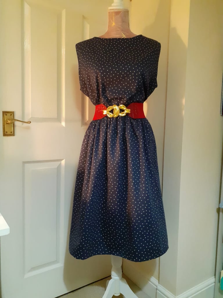 Black dress complete with red belt