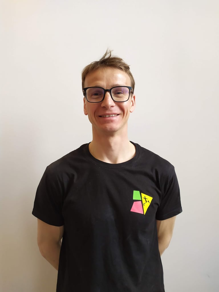 a man with glasses and a black shirt