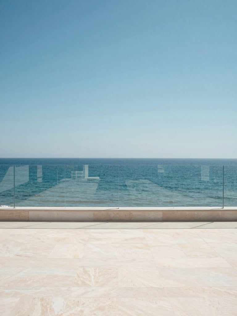 Wide environmental shot of a minimalist Costa del Sol terrace, frameless glass railing running along the edge, bright midday Mediterranean sun, the sea and sky filling the entire background beyond the glass, warm white stone floor in foreground, no people, architecture and horizon as subject, high contrast clarity