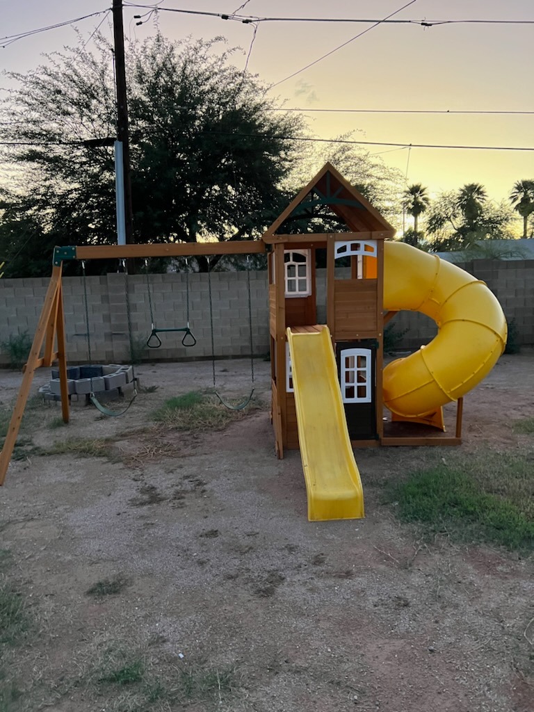 a playground with a slider and a slider