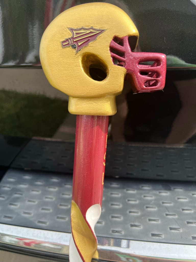 Carved pointy thingy Football Cane