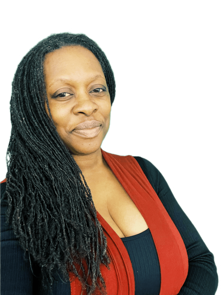 A Doula with long hair and a red vest, smiling warmly