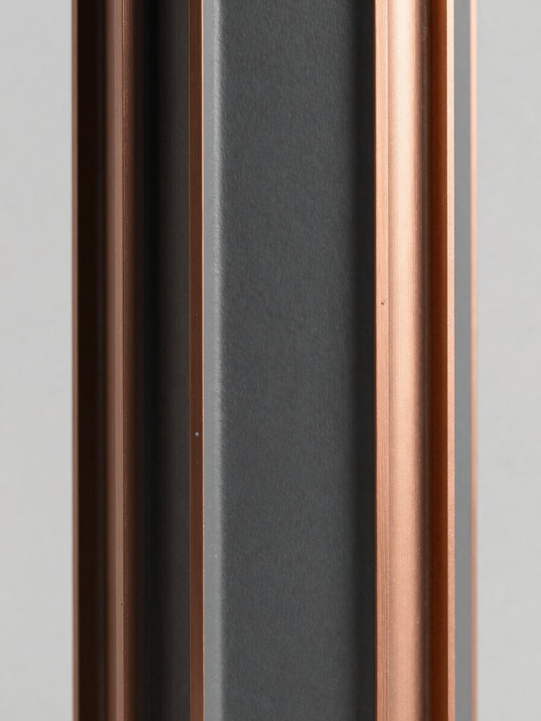 Detailed view of a high-precision automotive component, clean studio light, desaturated slate and warm copper tones, architectural framing, 50mm lens, focus on material texture and engineering detail.