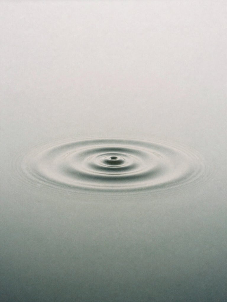 Macro shot of geometric water cymatics, symmetrical, diffused overcast morning light, muted alabaster and slate tones, 35mm film