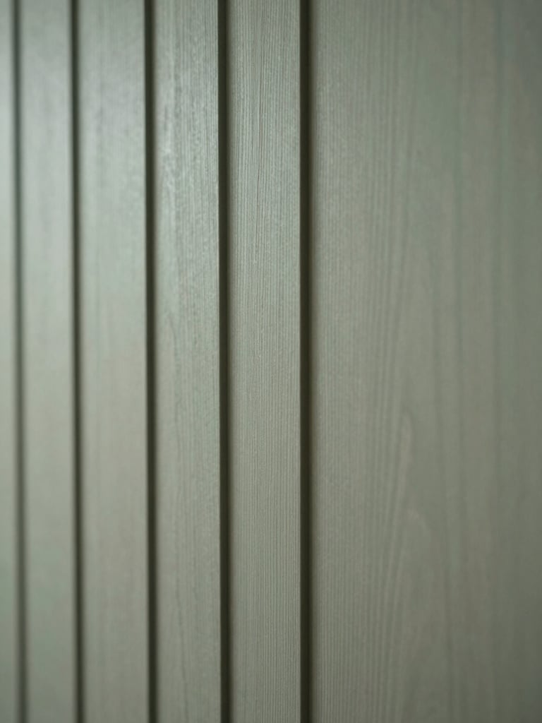 Close-up of tactile oak wood paneling in soft diffused northern light, minimalist architectural detail, calm atmosphere