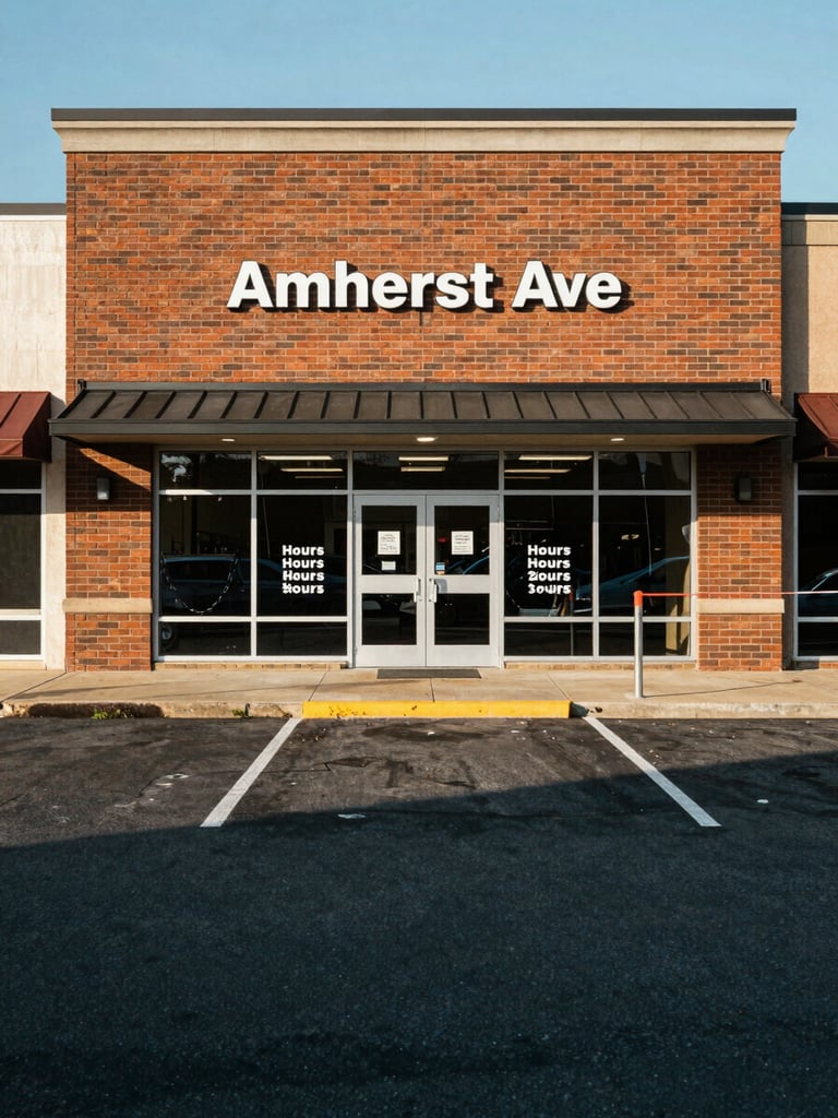 Wide environmental shot of a retail storefront on Amherst Ave, Springfield, Virginia — brick facade, posted hours signage visible in the window, a parking area in the foreground, natural midday daylight falling flat and even across the building face, shot from across the parking lot to show the entry and surrounding street context