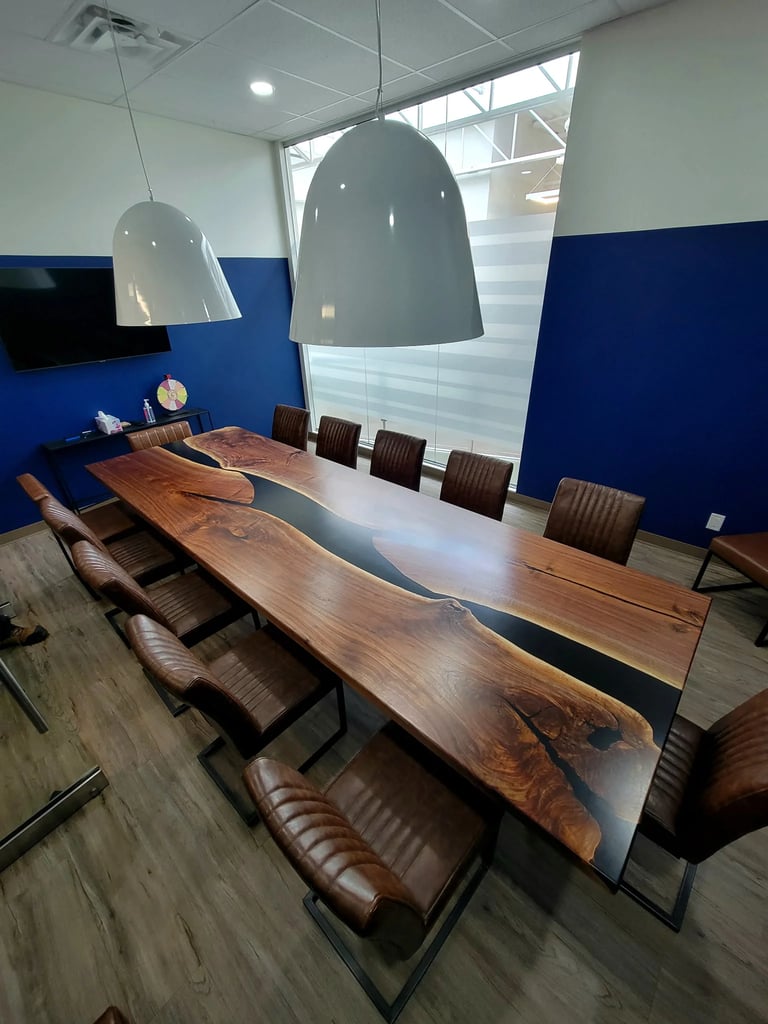 12ft x 4ft black walnut black epoxy river boardroom table — installed view, built for Polaris