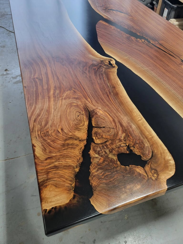 Black walnut black epoxy river boardroom table — wood grain and epoxy channel detail close-up