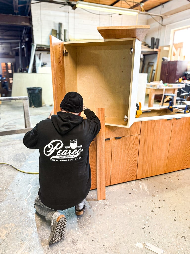Master woodworker and artisan craftsman handmaking custom cabinetry.