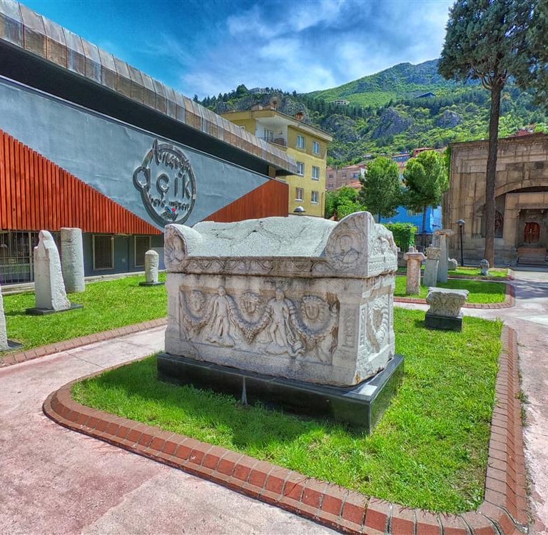 Ancient Roman sarcophagus and artifacts on display at the Amasya Archeology Museum in Turkey.