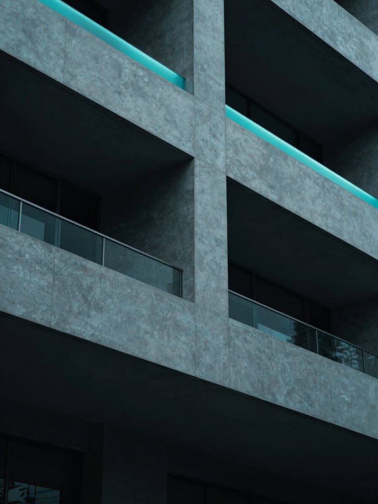 Minimalist architectural detail of a modern clinic facade, sharp geometric concrete lines under cool teal rim lighting, deep navy shadows, 35mm