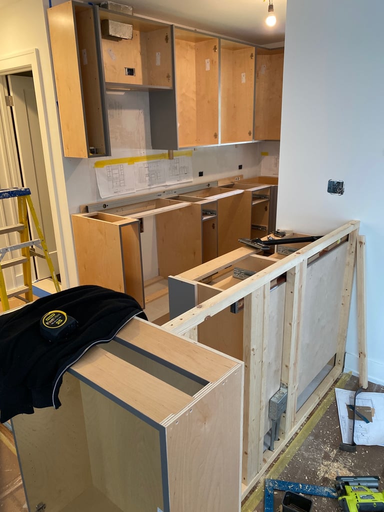 During a kitchen remodeling with blueprints and tools.