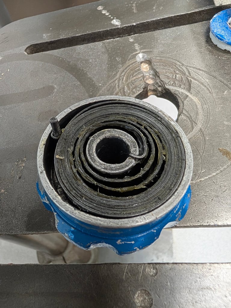 Original quill spring housing with a modern spring fitted, too tight to actually function.