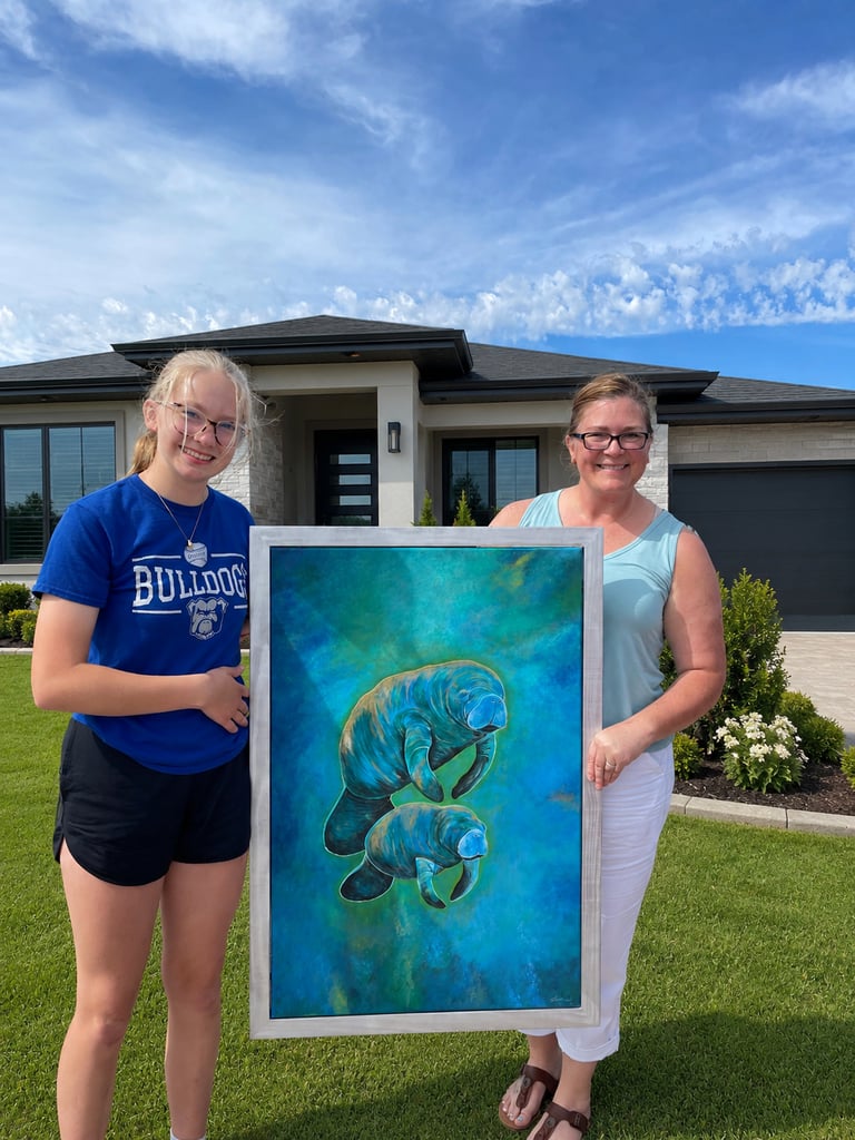 A mother manatee and her baby - Charity Bell and her adorable daughter