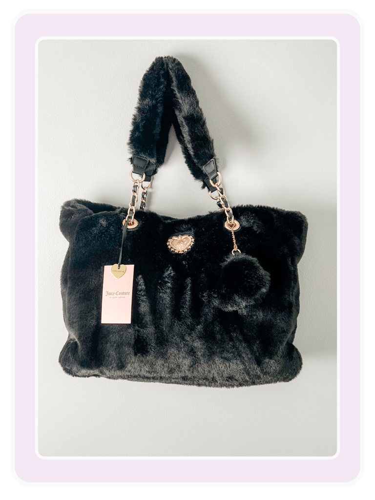 Black Juicy Couture faux fur tote bag with gold chain straps and a crown logo embellishment.