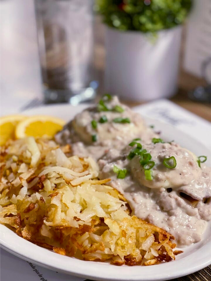 poached eggs on sourdough french bread sausage gravy