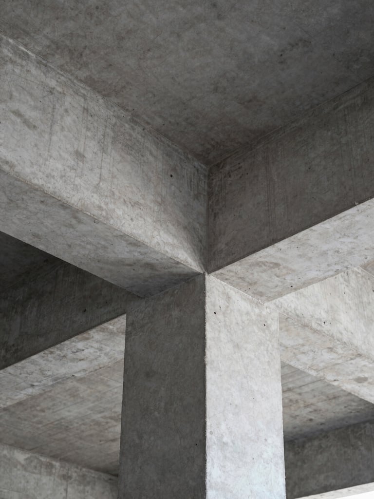 Close-up of raw concrete and structural steel beams, sharp natural light, architectural detail, minimalist texture, 35mm