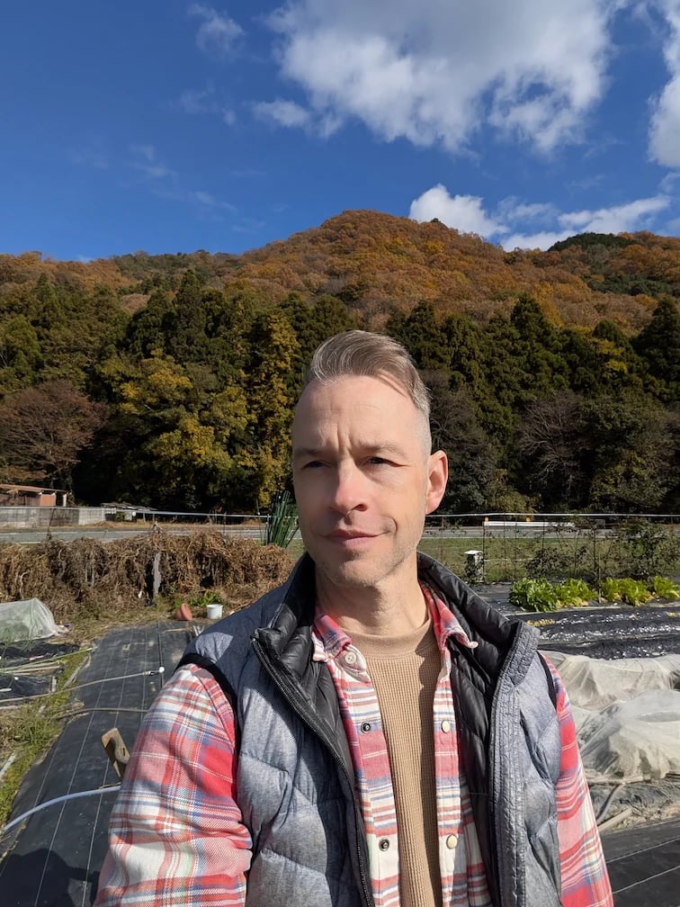man standing in garden