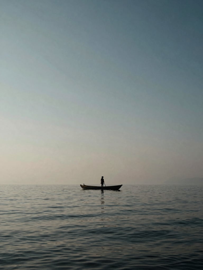 A lone fisherman on a vast misty lagoon in Hue, enormous sky reflecting on water, tiny scale of the boat against the grand horizon, high-contrast natural light, cinematic editorial.