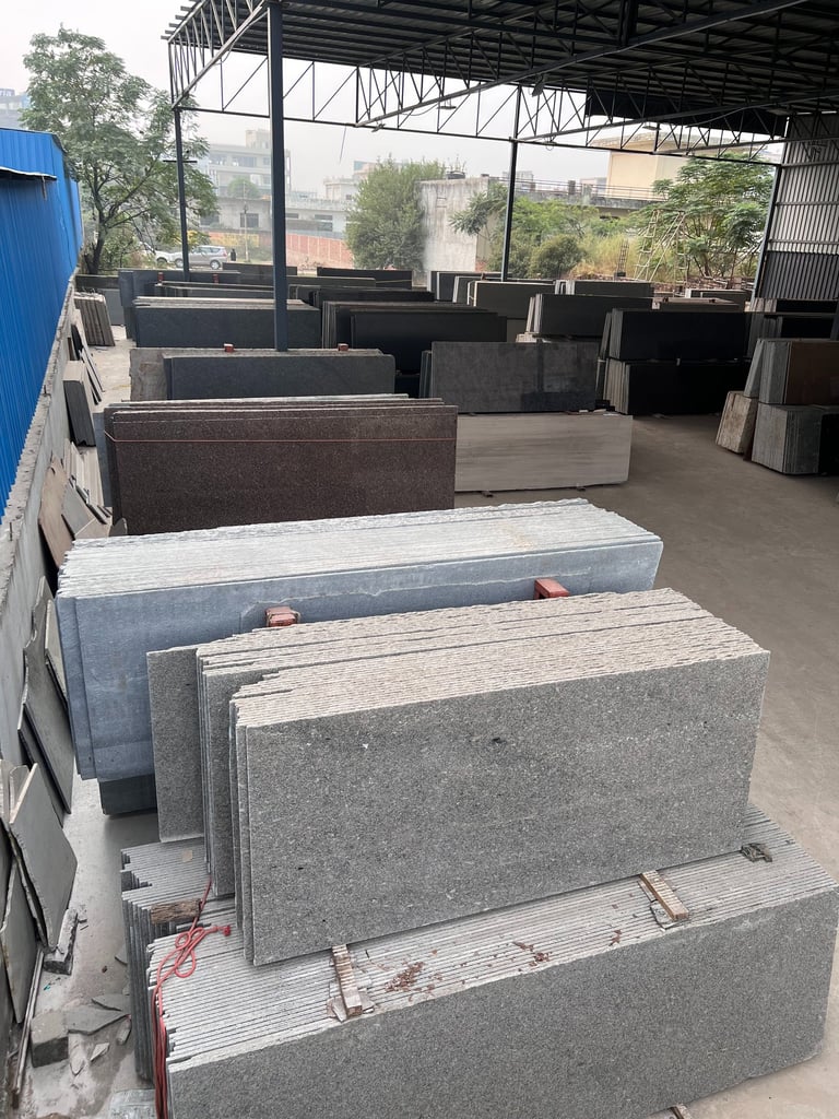 a pile of granite slabs in a gold stone granites mohali warehouse
