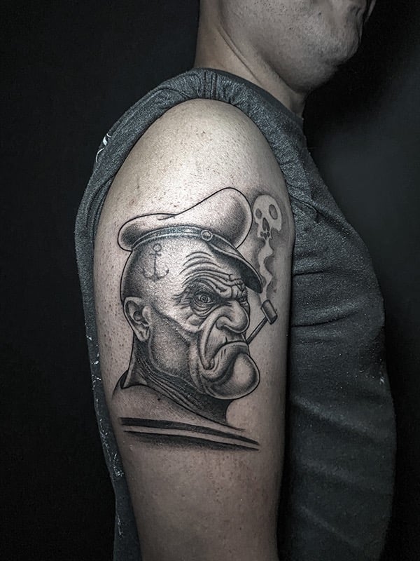 Tatouage d'un papaye badass.