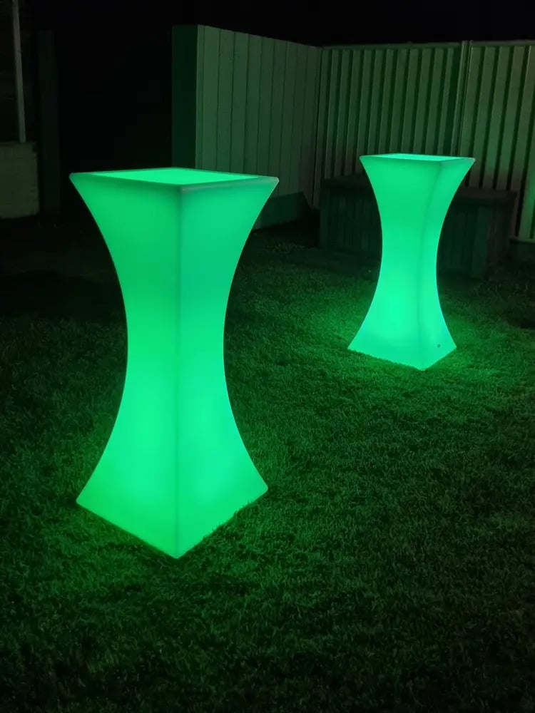 Green glow cocktail tables in the backyard of a halloween event in Gold Coast.