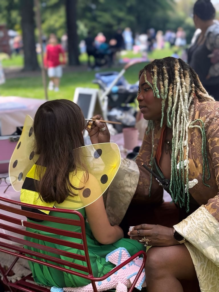 face painting a child at a halloween event