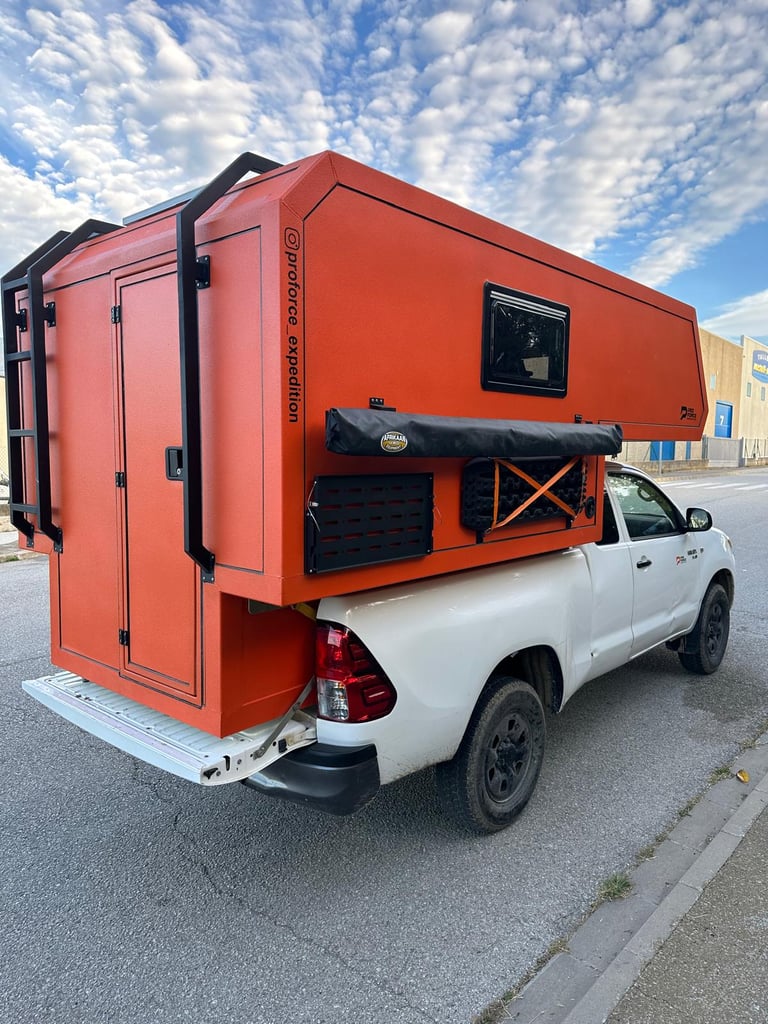 pick-up truck red camper