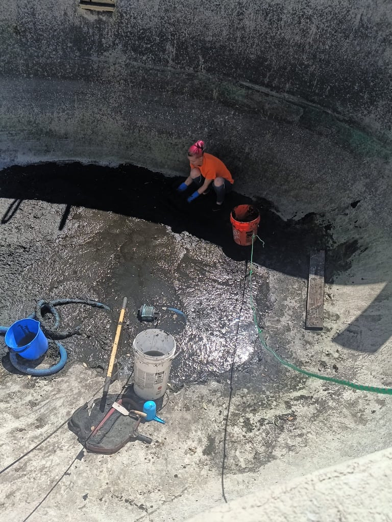 Hand Digging to Remove Mud