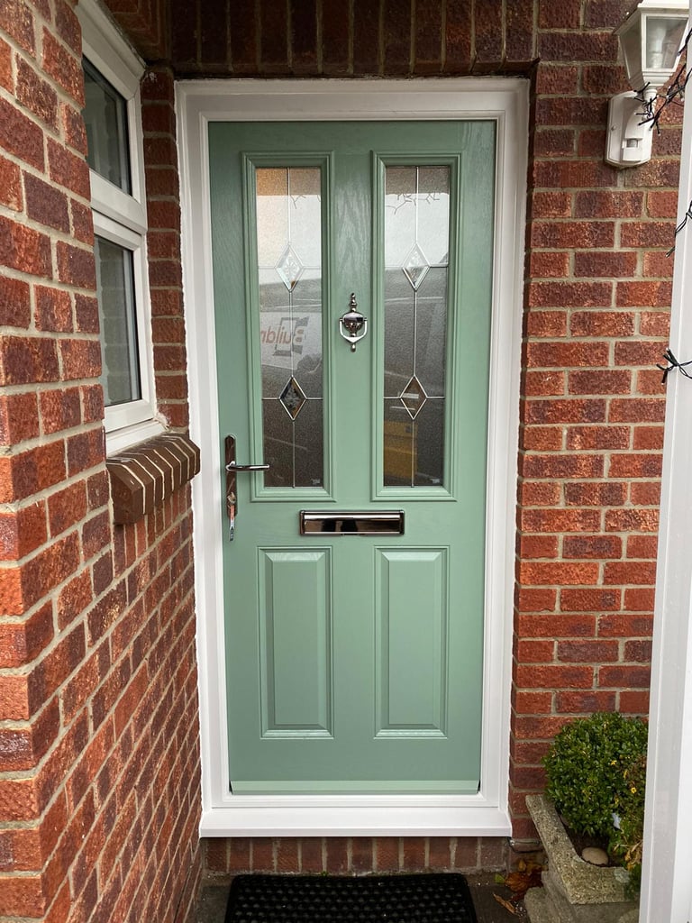 a new chartwell green l front door on red brick house installed by buildmydoor 