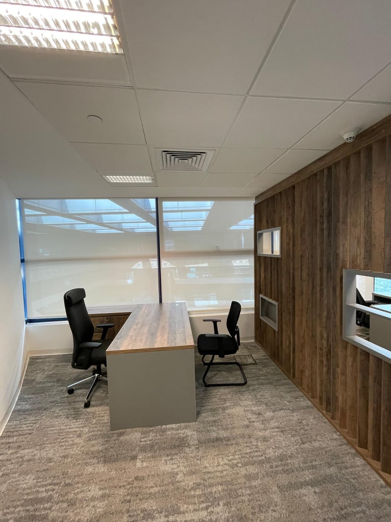 L-shaped executive desk with decorative wall panel and storage unit — manager office furniture suppl