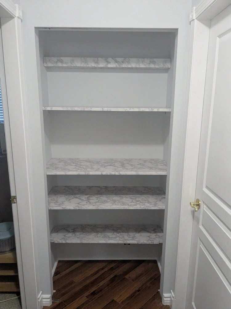 New kitcheware shelves installed, with shelf liner