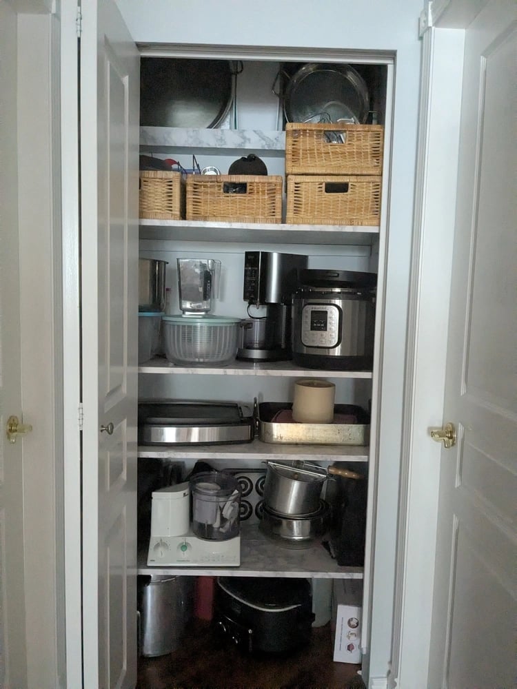 Organized kitchenware closet with strong shelving