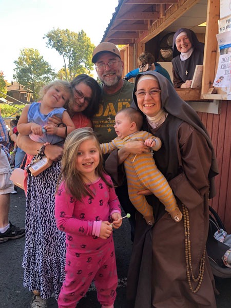 A family receiving help from the Rose Garden Mission