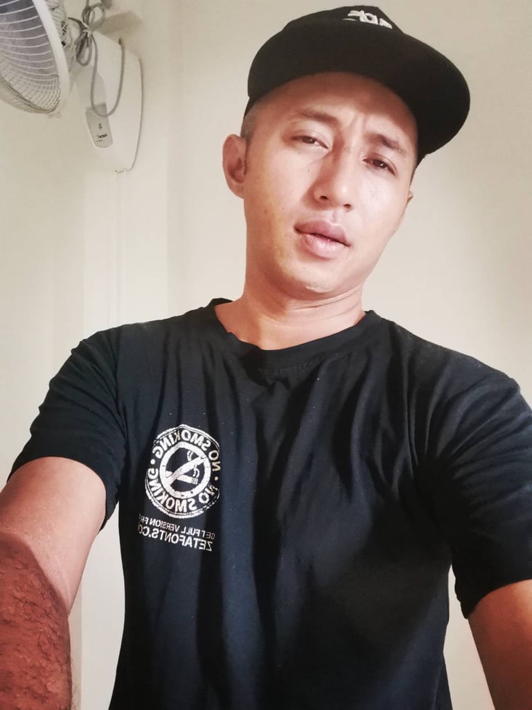 Male therapist wearing a cap taking a selfie