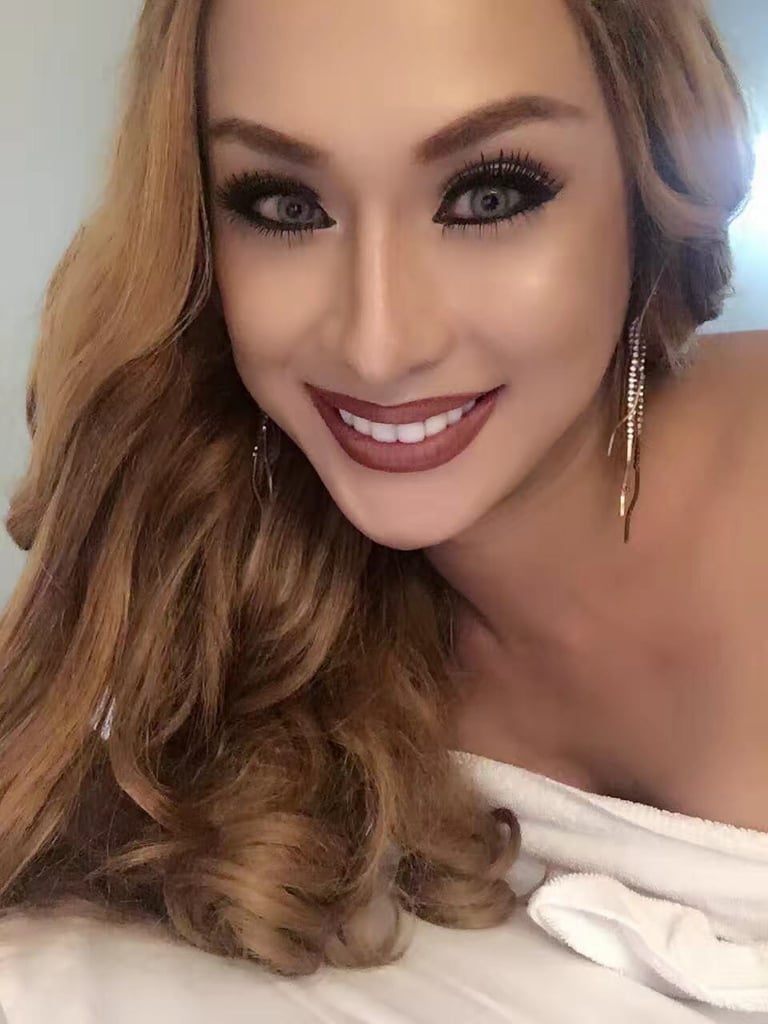 Portrait image of a smiling ladyboy therapist